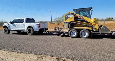 towing a skid steer with a half ton|Towing with 1/2 ton .